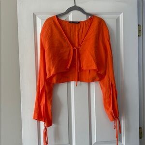 Zara orange long sleeve tie in the front top